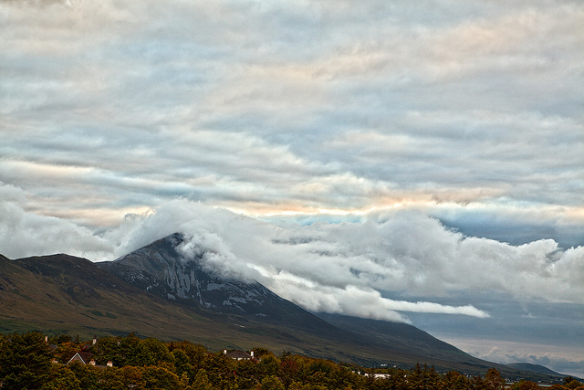 Tall mountains with clouds rolling across the peeks