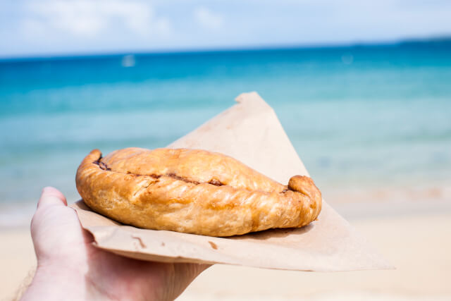 cornish pasty in front of sea