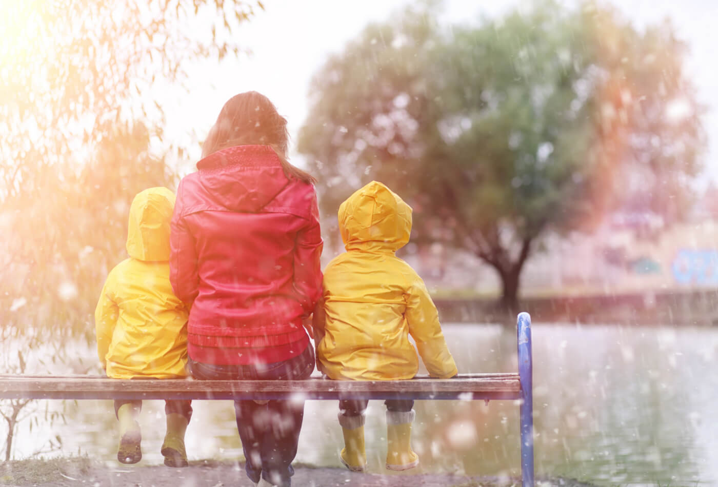 Family sitting in the rain