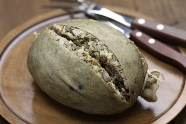 haggis on plate with cutlery