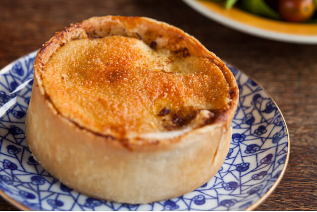 scotch pie on top of a blue plate