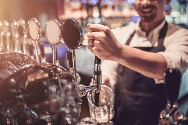 Bartender pouring beer