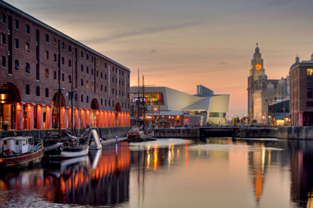 Sunset shot of Liverpool's Albert Dock, with the Royal Liver Building in visible in the background.