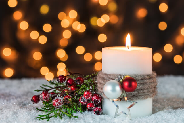 Christmas decoration with burning candle