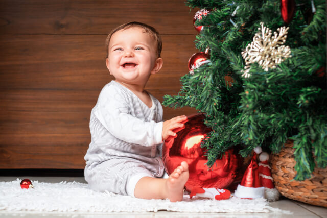 baby at christmas tree