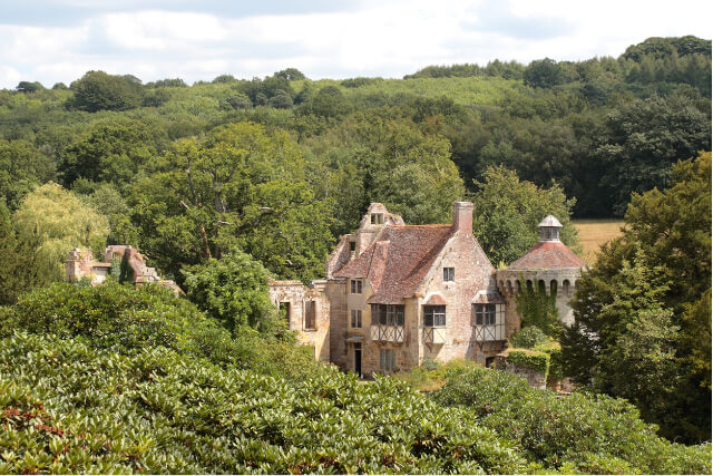 National Trust's Scotney Castle set within the trees, in Kent, High Weald AONB