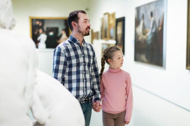 father and daughter in museum