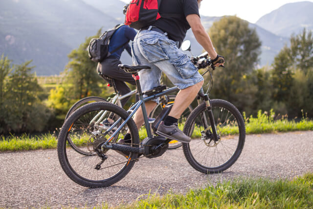 Two people cycling