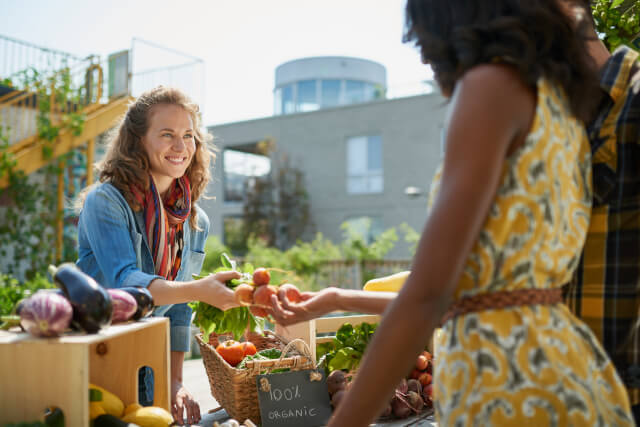 Woman buying from a market stall