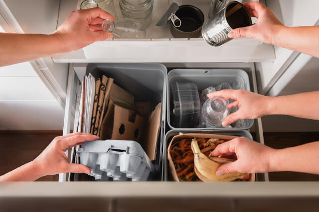 People using eco-friendly waste management