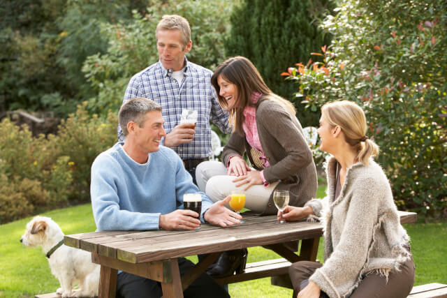 group of people in beer garden with dog