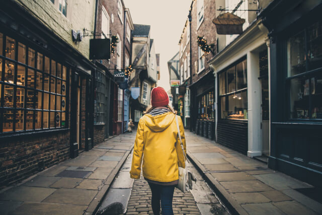 Girl walking through festive York