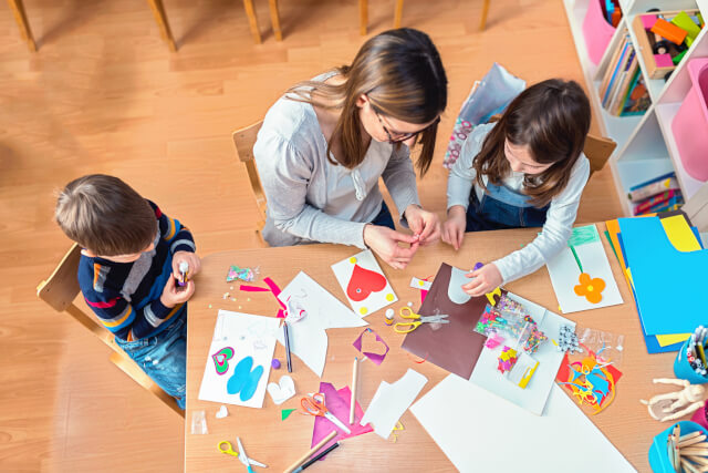 family enjoying arts and crafts