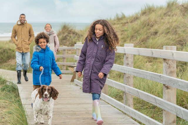 Family walking along Bennar Beach Boardwalk