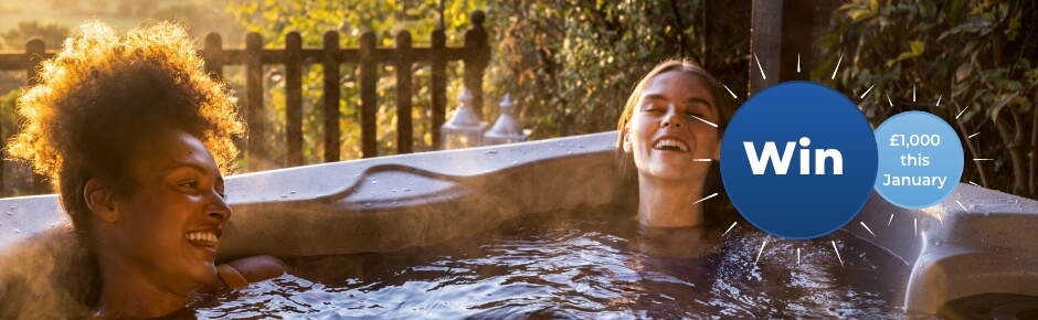 Two women in a hot tub with win roundel for Sykes January giveaway