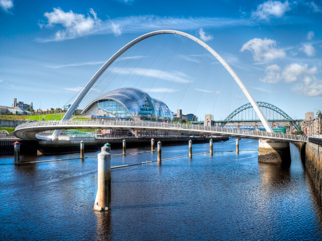 Gateshead Millennium Bridge and Tyne Bridge over the River Tyne in Newcastle