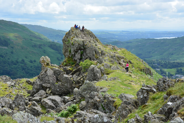 people climbing helm crag