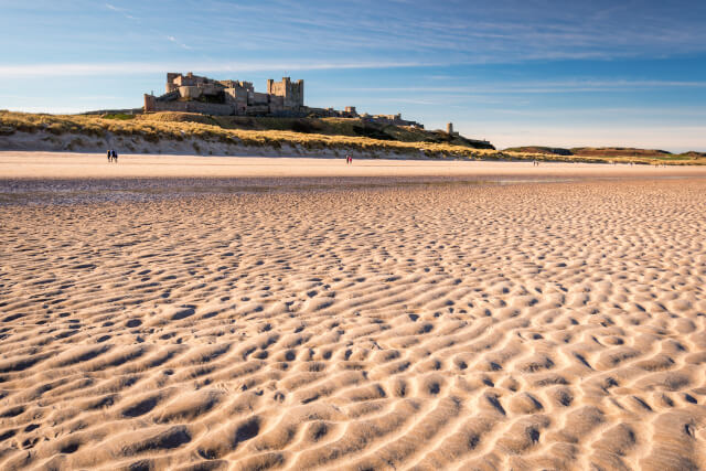 bamburgh beach with the castle in the distance