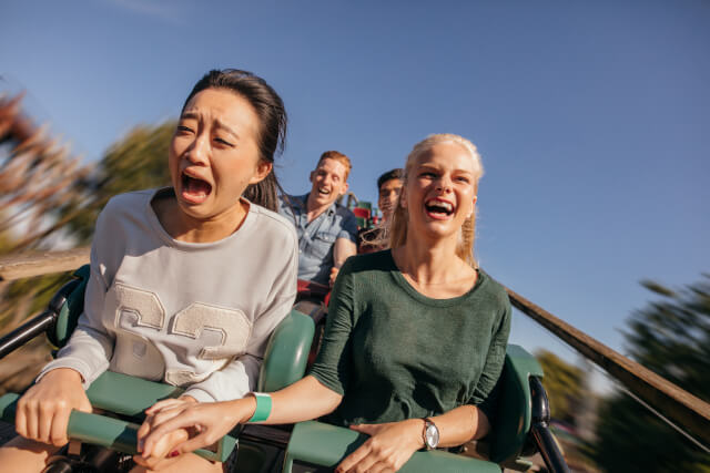 group of friends on a roller coaster