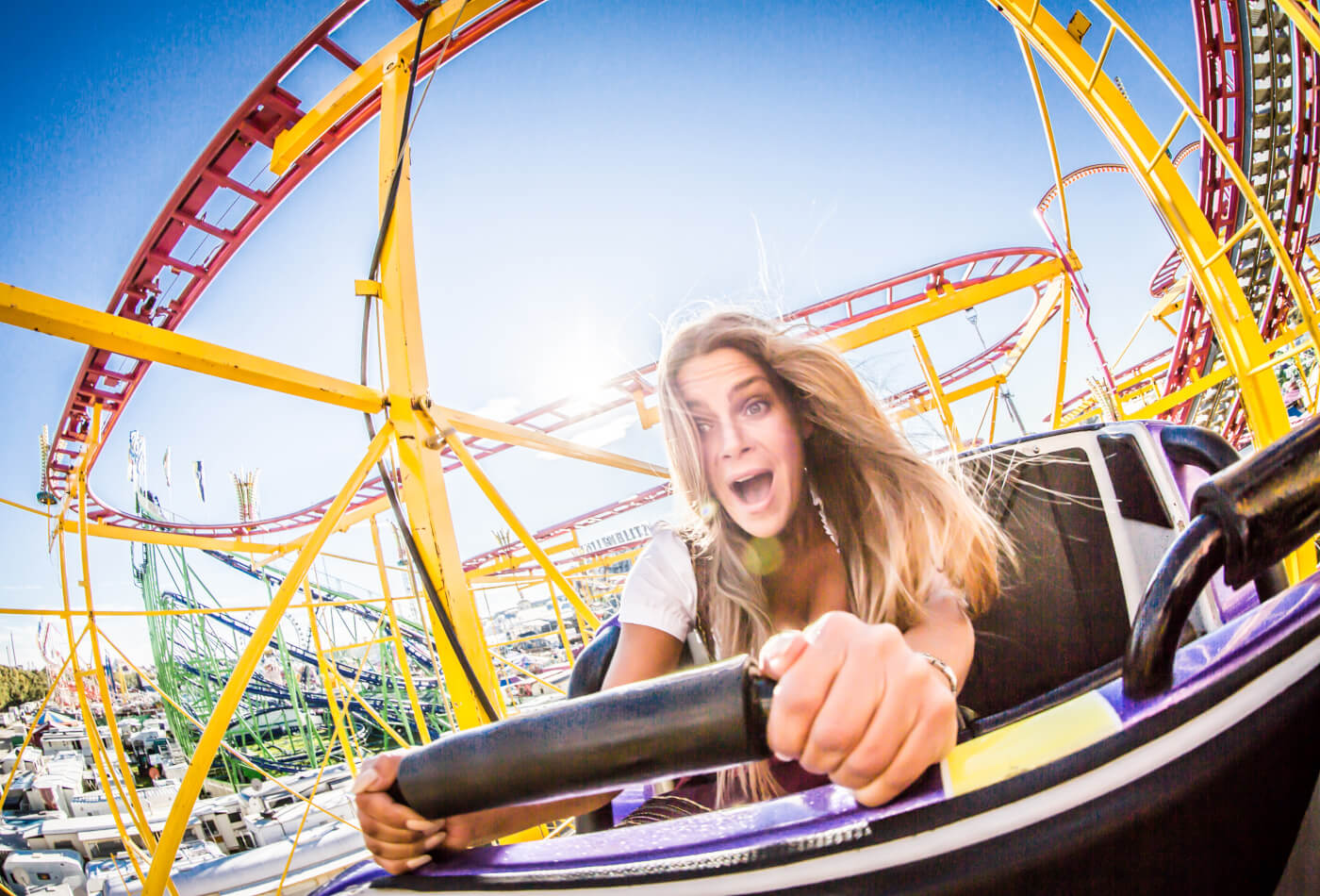 lady riding a roller coaster