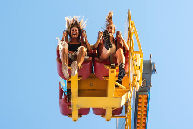 pair of friends on a roller coaster
