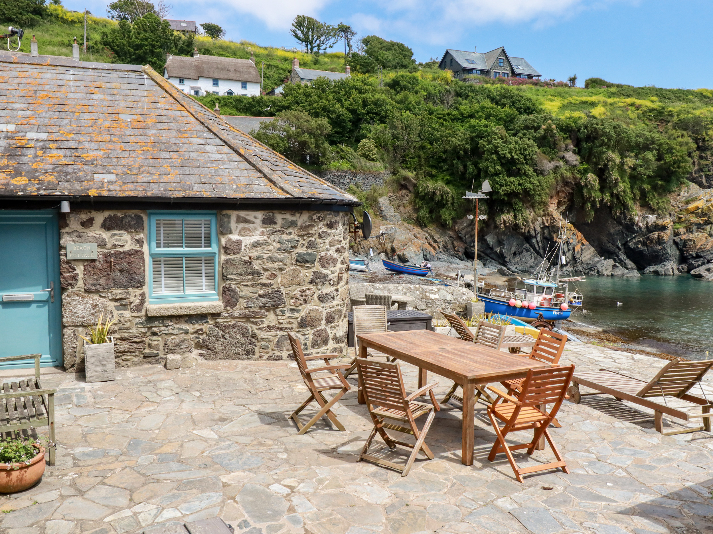 Stonebuilt, sea front property in Cornwall with outdoor furniture