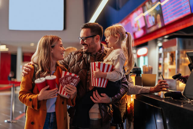 family buying snacks at the cinema