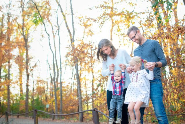 family of four in a forest