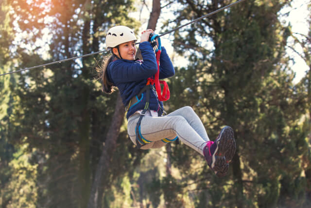 girl enjoying the zip wire