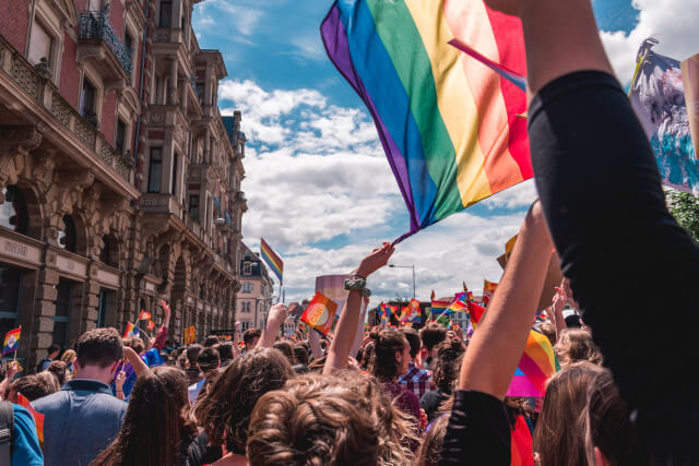 pride parade waving a flag