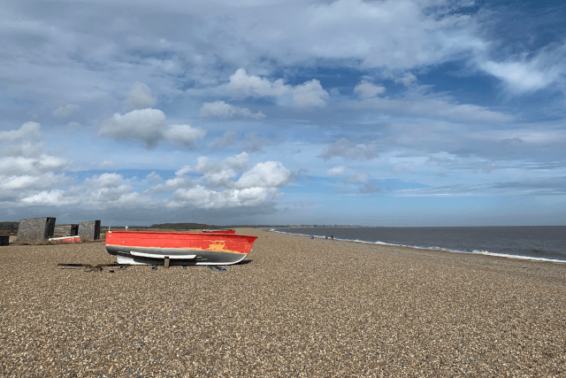 red boat on dunwich beach