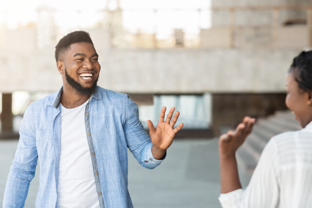 man and woman greeting each other