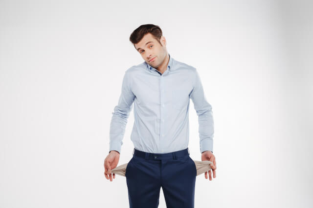 man showing empty pockets