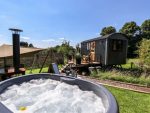 Exterior shot of Limetree Luxury Glamping Southdown and hot tub.