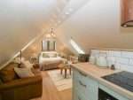 Open-plan living space in Pheasants Rise Apartment.