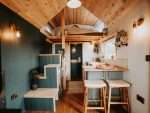 The cosy open-plan interior of Tiny Home Driftwood in Carreglefn, Isle of Anglesey.