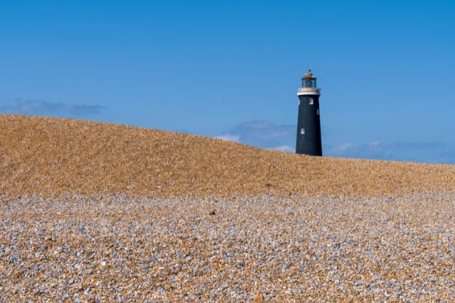 Dungeness Beach with old Dungeness lighthouse in the background