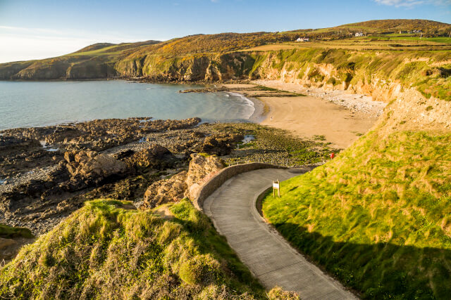 Aerial shot of Porth Swtan, looking onto the beach from the footpath