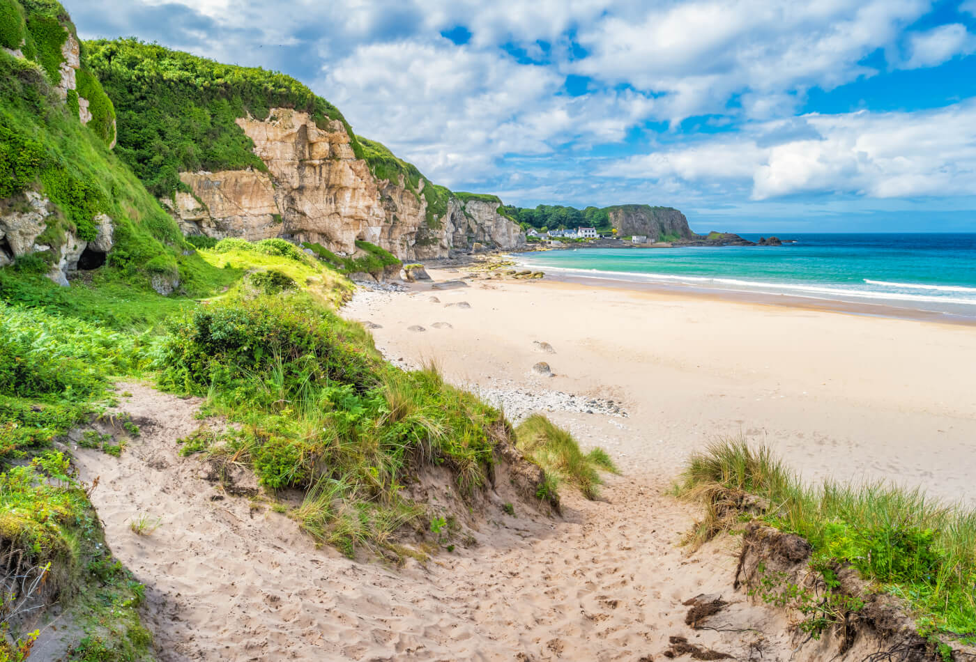 A view of White Park Bay, a beach on the Causeway Coast in County Antrim, Northern Ireland. One of the Best Beaches in Northern Ireland