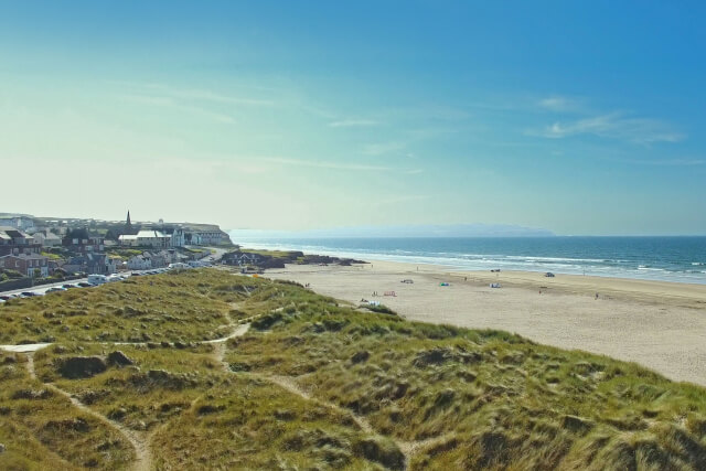 Looking westward across Castlerock Beach from the dunes, with the town of Castlerock visible in the background