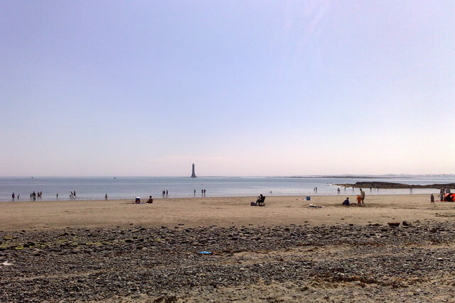 Looking south across Cranfield Beach in County Down (Northern Ireland), with Haulbowline Lighthouse visible offshore