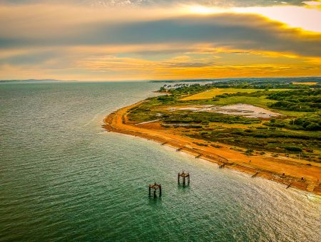 Sweeping aerial shot of a beach in Hampshire, England