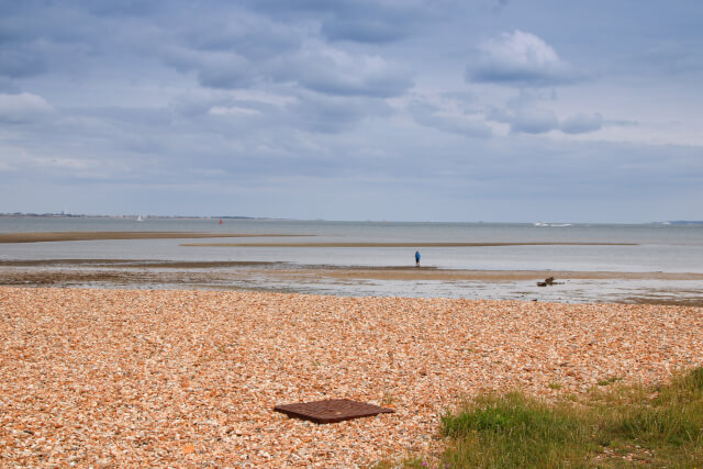 View across the shingle on Calshot Beach, one of the best beaches in Hampshire