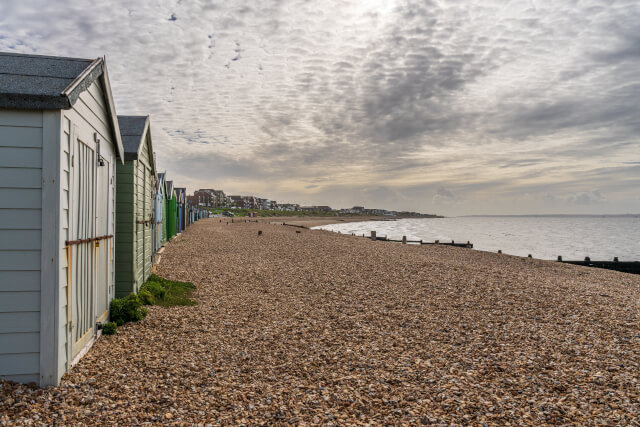 Image of beach huts lining Lee-on-the-Solent Beach