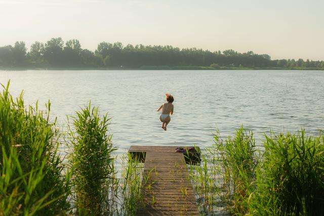 Woman wild swimming in a Lake