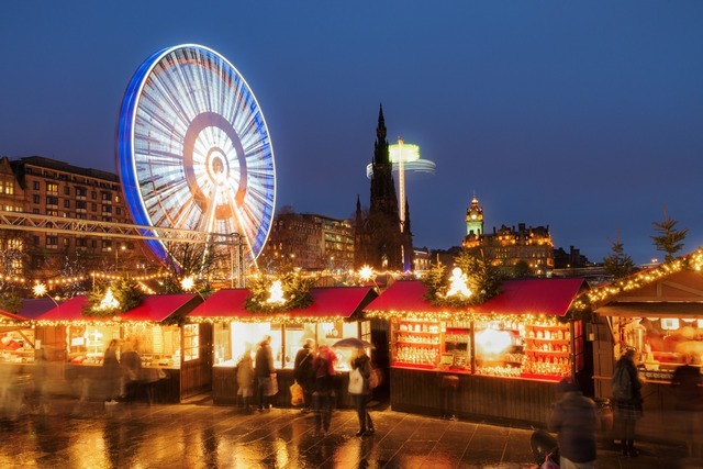 Edinburgh Christmas market stalls and Ferris wheel in Princes Street Gardens.