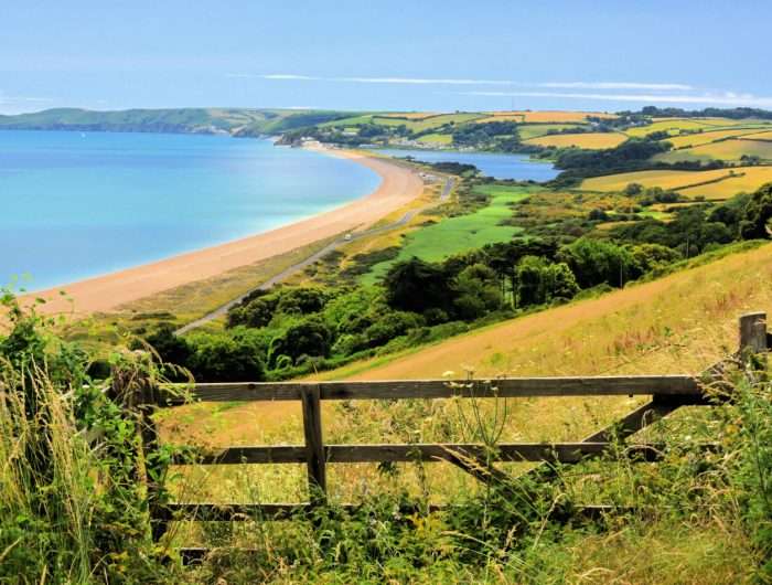 A view along the Devon coast at Slapton Sands, with The Ley at Torcross visible in the distance.