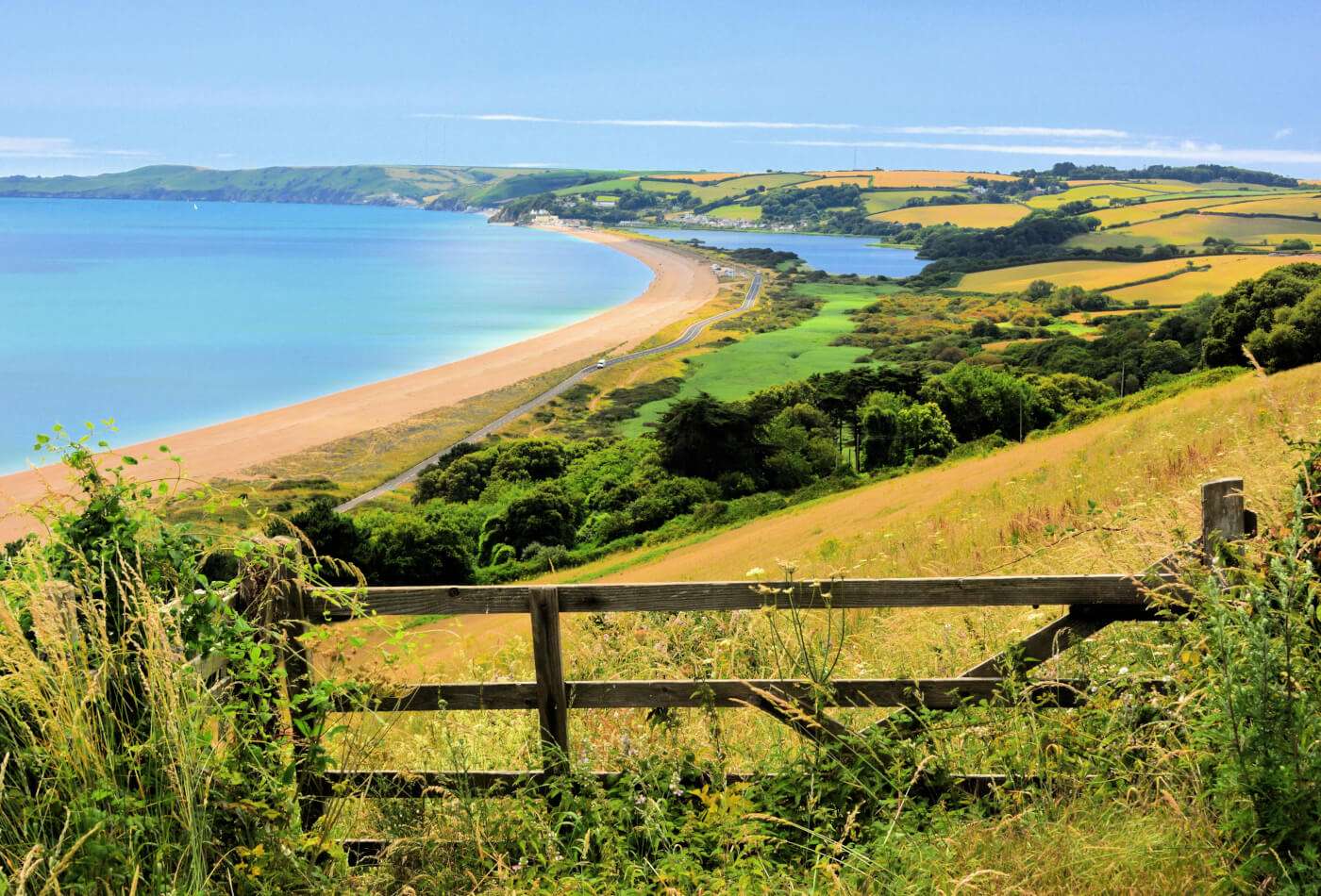 A view along the Devon coast at Slapton Sands, with The Ley at Torcross visible in the distance.