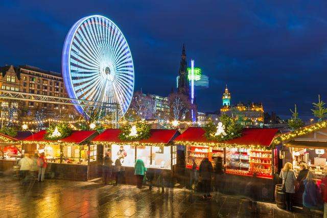 Wide shot of Christmas markets in Princes Street Gardens, Edinburgh.