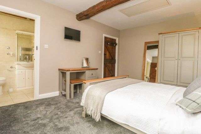 Bedroom with en-suite in The Barn at Orchard Farm.